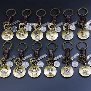 Llavero Metálico de las Doce Constelaciones, Signos del Zodiaco en Relieve, Cordón de Cuero, Venta al Por Mayor - Product Image 1