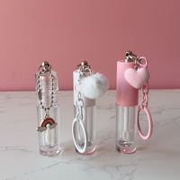 Tube à gloss transparent vide avec un grand pinceau et une chaîne d'accessoires en forme de cœur, contenant à gloss