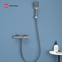 Robinet de baignoire mural en métal noir, monocommande avec douchette à main pour salle de bain, style moderne