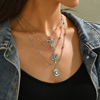 Collier ethnique style bohème western cowboy européen-américain avec perles noires incrustées en forme de riz AaaA et tête de taureau cactus