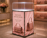 Vitrine professionnelle en acrylique LED pour sacs à main de luxe et articles en cuir avec base rétroéclairée pour l'affichage en magasin de mode