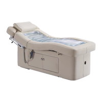 Table de massage électrique moderne personnalisée avec revêtement en cuir PU et fonction chauffante pour les soins de spa en hôtel