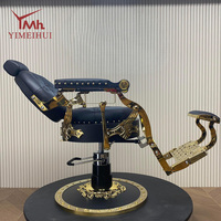 Chaise de barbier vintage de luxe, accoudoirs dorés décoratifs, cuir noir matelassé diamant, avec support hydraulique