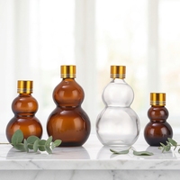 Vente en gros de flacons en verre pour huiles essentielles et cosmétiques, vides, fantaisie, en forme de courge, ambrés et transparents, anti-fuite, avec boîte, 10ml, 20ml, 30ml, 50ml, 100ml