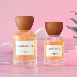 BAIDE Clear Empty Round Perfume Glass Bottle 30ml 50ml Crimp Perfume Bottle 100ml with wood lid