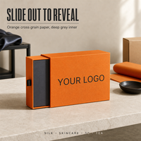 Boîte cadeau coulissante personnalisée en papier grainé orange avec impression de logo noir