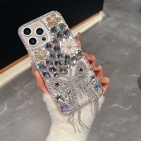 Nouvelle conception de coque de téléphone de luxe haut de gamme avec strass, adaptée à toutes les séries d'iPhone 17, anti-chute, avec pampille papillon