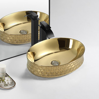 Lavabo à main en céramique dorée avec égouttoir pour hôtels et salles de bains Luxe moderne ovale Art au-dessus du comptoir