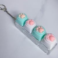 Porte-clés anti-stress à double patte de chat avec interrupteur mécanique pour clavier, jouet mignon, cadeau de Noël, de bureau ou de fête