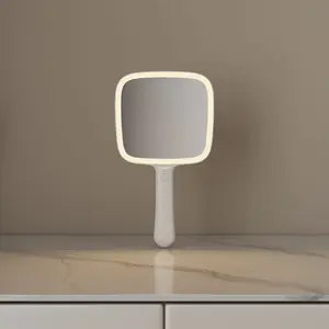 Logotipo personalizado cuadrado blanco pequeño viaje batería portátil de mano con mango luz Led maquillaje espejo de mano