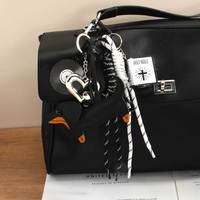 Sac Yiwu semi-artisanal en PU rétro style Miu, avec breloque Teckel, en forme de petit livre, avec cordon tressé à nœuds tennis et motif cœur