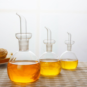 Botella de aceite de vidrio de borosilicato de alta calidad, tamaño personalizado, a prueba de fugas, redonda, para cocina, aceite, salsa, vinagre, aceite de oliva, venta al por mayor - Product Image 1