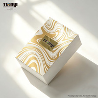 Emballage personnalisé pour flacon de parfum 100 ml, boîte rigide en carton gris à clapet avec insert en mousse EVA découpée et logo en feuille d'or