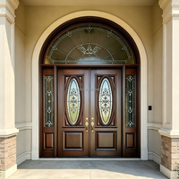Porte d'entrée double cintrée de luxe avec dessus arrondi et inserts en verre sur mesure pour l'architecture de villas modernes haut de gamme