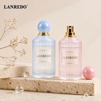 En stock, faible MOQ, flacon de parfum vide de haute qualité, pas cher, 30ml 50ml 100ml, flacon de parfum transparent bleu rose rayé avec bouchon à bille