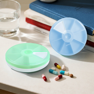 Caja de pastillas semanal de <span class=keywords><strong>7</strong></span> días, organizador redondo de <span class=keywords><strong>7</strong></span> rejillas, caja de medicinas, caja de almacenamiento de un día para pastillas sin dañar las manos - Product Image 1