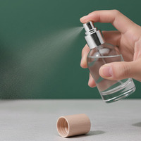 Flacon de parfum élégant de 50ml avec pulvérisateur et bouchon en bambou Récipients de maquillage Flacon de parfum rond en verre