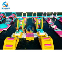 Jeux aquatiques gonflables géants en PVC durable sur le thème de l'arc-en-ciel pour la plage, licorne flottante pour usage commercial en parc, 500 kg