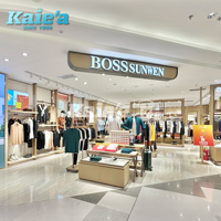 Conception de décoration intérieure moderne pour magasin de vêtements, présentoirs à vêtements dorés personnalisés, comptoir de magasin pour boutique de vêtements