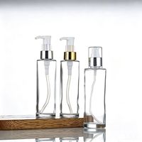 Flacon pompe à lotion rond en verre givré transparent de 60 ml, 80 ml, 100 ml avec bouchon supérieur noir, or, argent, logo personnalisé, utilisation cosmétique