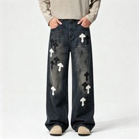 Jeans amples à coupe croisée de style américain haut de gamme pour hommes, avec patchs en cuir croisés et motifs brodés