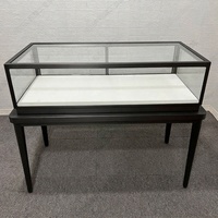 Comptoir de présentation de bijoux de luxe en acier inoxydable noir avec dessus en verre, éclairage LED, vitrine d'exposition verrouillable pour montres