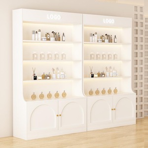 Mueble de Exhibición Cosmético Minimalista Blanco con Iluminación LED y Puertas de Almacenamiento para Salón de Belleza - Product Image 1