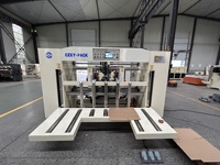 Machine à piquer semi-automatique à double pièce pour la fabrication de boîtes en carton ondulé