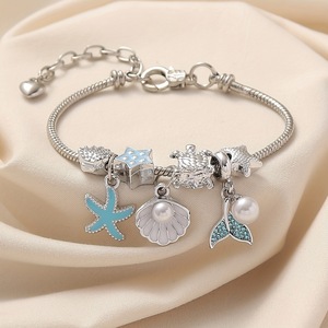 Pulsera de dijes con cuentas estilo marino, con colgantes esmaltados de estrella de mar, cola de sirena y delfín, ajustable, joyería DIY para mujeres y niñas - Product Image 1