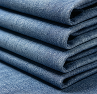 Tissu denim tissé à effet flammé pour vêtements féminins, chemises, jupes et pantalons en coton uni