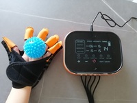 Gants robotiques de rééducation personnalisables pour la récupération d'AVC Modes d'entraînement multiples Entraîneur de rééducation des doigts pour application manuelle