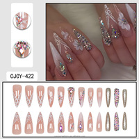 Tendances européennes et américaines en matière de faux ongles : motifs floraux pré-faits avec strass, ongles à presser, ongles artificiels