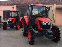 Tracteurs Kubota M704KQ 4 roues motrices d'occasion avec remorque à benne basculante et tondeuse à gazon
