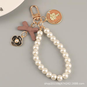 Nouveau arc porte-clés pendentif mignon perle chaîne beauté tête métal rond étiquette accessoires sac décoration - Product Image 6