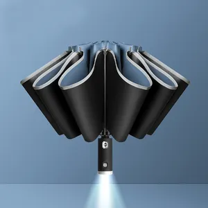LED kompakter faltbarer umgekehrter reflektierender winddichter automatischer 23 Zoll leichtes Regenschirm auf den Boden