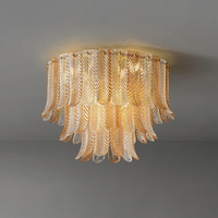Plafonnier en verre Plume, hauteur réglable, longue suspension ronde en fer doré