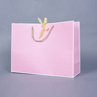 Sac en papier rose personnalisé de luxe pour vêtements, cadeaux et bijoux