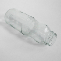 Vente en gros de bouteilles en verre rondes transparentes de 300 ml avec bouchon à vis pour jus et boissons - Emballage de haute qualité et durable