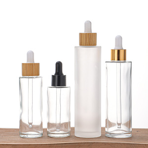 Custom Empty Cosmetic Packaging Eye Drops and Essential Oil Cylinder Transparent Glass Dropper Bottles 100ml Skincare <strong>Essence</strong> - Product Image 1