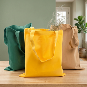 Bolsa de lona grande verde, amarilla y beige con asa superior para compras. - Product Image 1