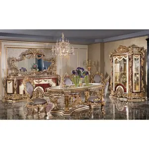 Ensemble de meubles de salle à manger en bois de luxe classique famille royale Table à manger sculptée à la main en or antique avec chaises