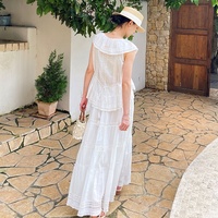 Ensemble deux pièces personnalisé pour femme : jupe longue bohème à volants et décolleté en V, et haut en dentelle crochetée pour la plage et les vacances. Fabricant OEM ODM.