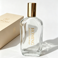 Nouvel Arrivage Flacon de Parfum Irrégulier Vide avec Pompe Atomiseur Transparente à Sertir 100ml en Verre avec Bouchon Noir