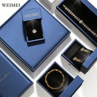 Boîte à bijoux en cuir PU bleu avec lumière LED pour bague collier pendentif logo personnalisé affichage d'emballage haut de gamme
