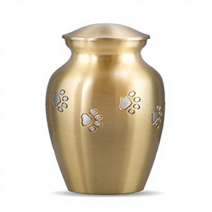 Urne funéraire artisanale en métal pour animaux de compagnie avec empreintes de pattes, finition Aurore Boréale, forme ronde, pour hommage. - Product Image 1