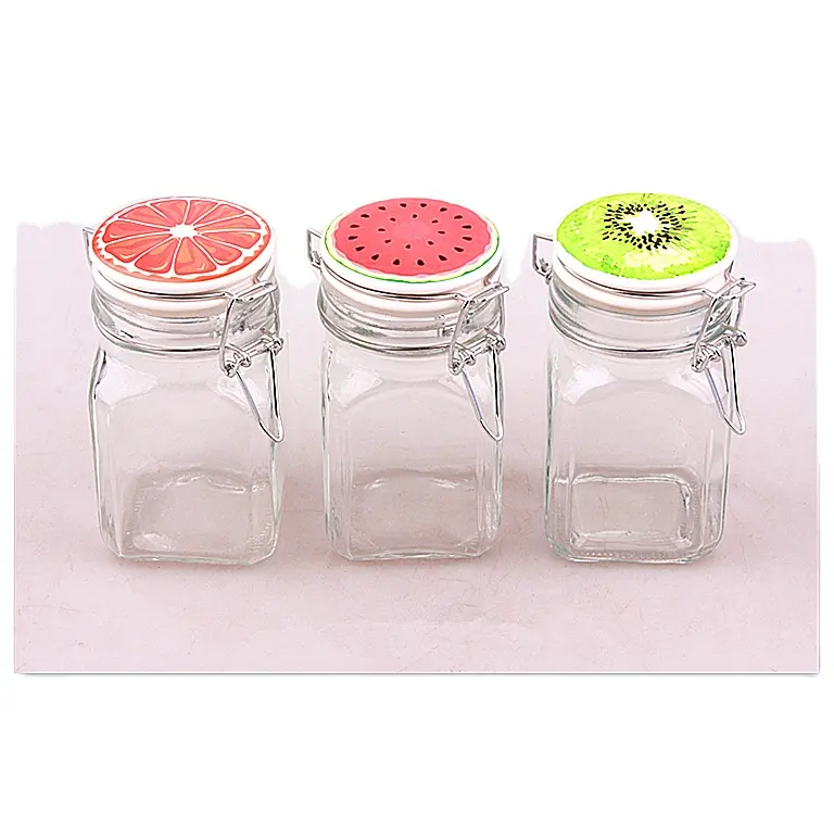 New design Fruit series 270ml square glass candy spice storage jar with ceramic clip top and fruit design for kitchen storage