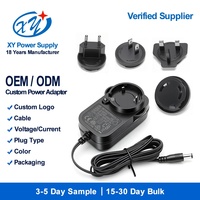 Adaptateur secteur universel interchangeable AC/DC 12V 2A 24W avec prises internationales CE UKCA SAA