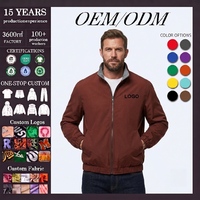 Veste coupe-vent réversible pour homme en tissu technique, col montant, fermeture éclair bidirectionnelle, intérieur contrastant, coupe-vent, style bomber