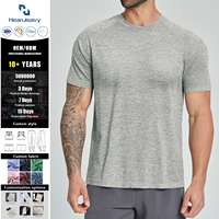 T-shirt pour homme à manches raglan, séchage rapide, coupe ajustée, gris chiné uni, col rond, design vierge, mouvements libres, idéal pour la gym