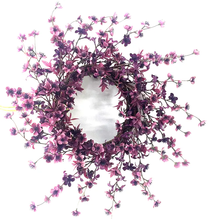 faux cherry wreath adorns purple cherry blossoms